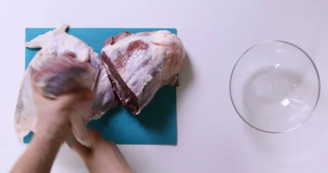 Top view of man hands cutting fresh meat on white table. Stock Footage 96678780