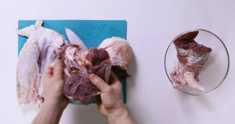 Top view of man hands cutting fresh meat on white table Stock Footage 96679022