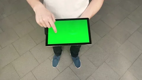 Top view of man holding laptop with green screen, concept of ecommerce and Stock Footage 202073867