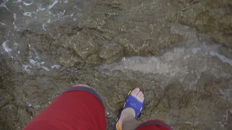 Top view of man legs walking on the beach stock video footage Stock Footage 65329396