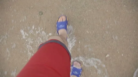 Top view of man legs walking on the beach stock video footage Stock Footage 65329402