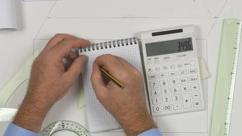 Top View Man Make Technical Calculations Use Adding Machine and Write on Paper Stock Footage 84858593