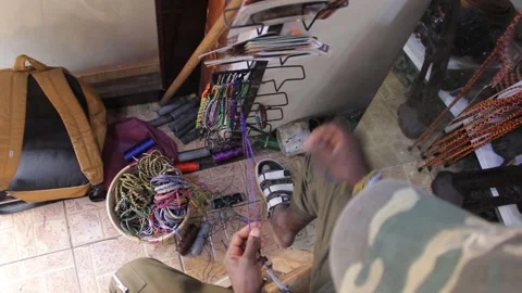 Top view of a man making hand braslets Stock Footage 162973067