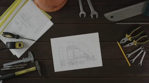 Top view of a man measuring the schematics Stock Footage 80016322