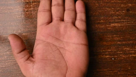 Top View of Man Open Palm Hand on Wooden Table – Front Side View   Video Stock Footage 329353336
