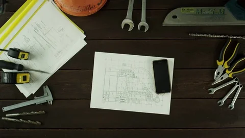 Top view of a man photographing the schematics Stock Footage 80048959