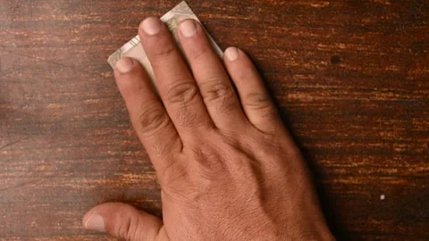 Top View of Man Placing 500 Rupee Notes One by One on Wooden Table 스톡 동영상 329346795