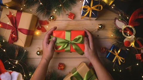 Top View of Man Placing Christmas Gift on The Center Stock Footage 96115610