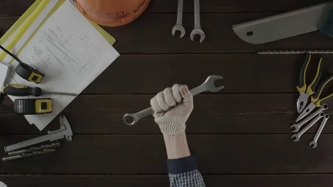 Top view of a man playing with a wrench Stock Footage 80035452