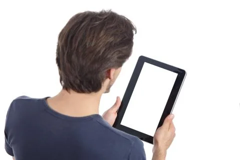 Top view of a man reading a tablet showing its blank screen Stock Photos