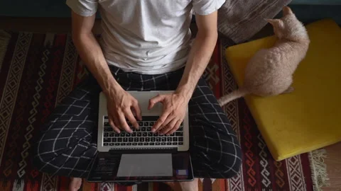 Top view of man sit on floor with carpet and type text on laptop keyboard. Spbas Stock Footage 133085396