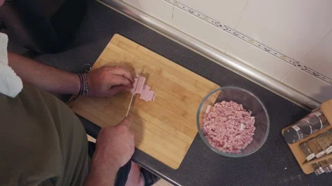 Top view of a man slicing ham at home Stock Footage 337622275
