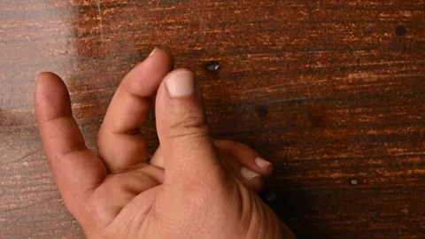Top View of Man Snapping Fingers on Wooden Table – Attention Gesture Stock-Footage 329353565