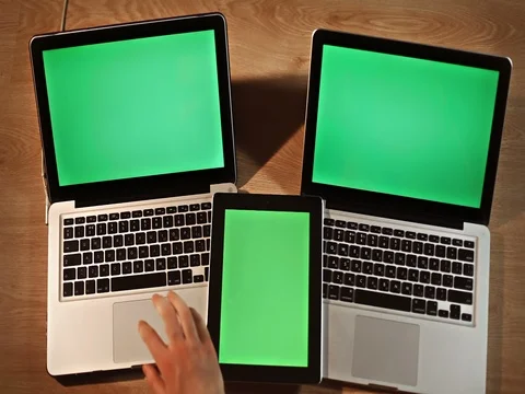 Top view man using digital tablet and two laptops Stock Footage 72412641