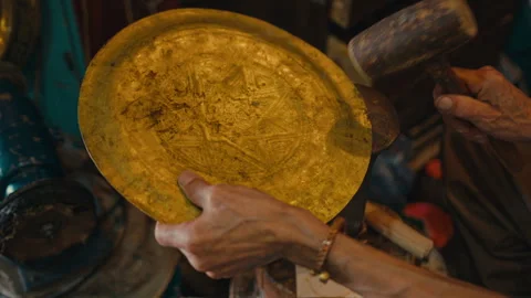 A Top view of a man using a hammer on brassware Stock Footage 270453835