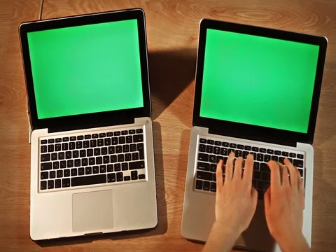 Top view man using two laptops at once fast typing and making rapid task Stock Footage 72412460