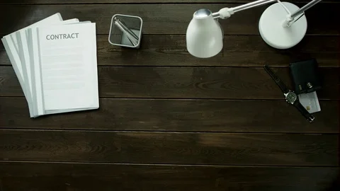 Top view. A man writes stikers the word do it. Stock-Footage 82193803