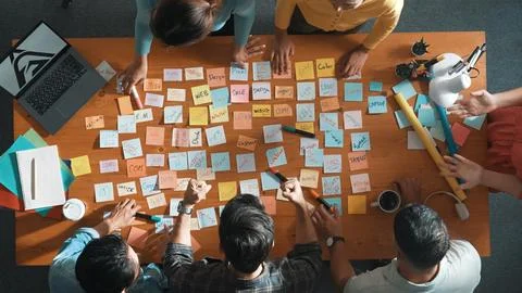 Top view of manager looking idea on sticky notes and explain idea. Symposium. Stock Photos