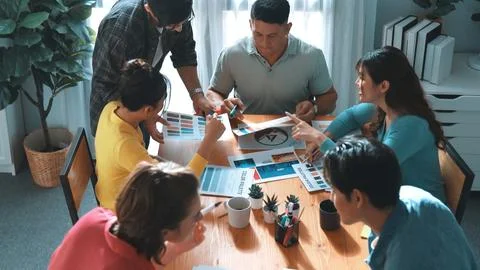 Top view of manager writing idea on sticky notes and explain idea. Symposium. Stock Photos