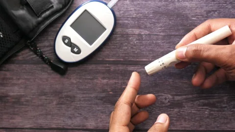 Top view of man's hand measuring blood sugar level Stock Footage 135415769