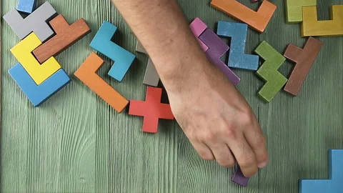 Top view on man's hand playing with colorful wooden blocks Vídeo Stock 92119225