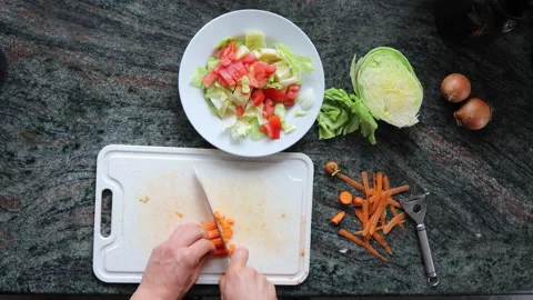 Top View of Man's Hands Cutting Carrot, Fast Motion, 4k Stock Footage 135228478