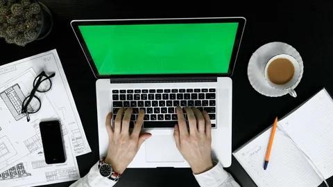 Top view of man's hands making notes in paper notebook by pen in wooden table. Stock Footage