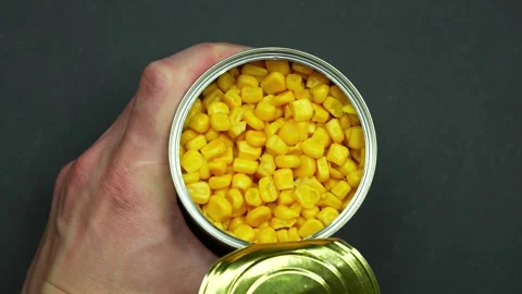Top view man's hands opening corn jar Stock Footage 243593050
