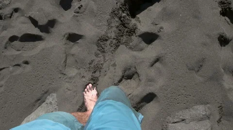 Top view of man's legs walking into the ocean Stock Footage 59337761