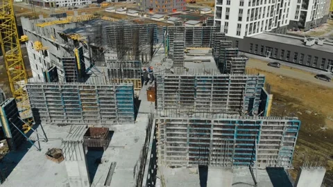 Top view of manual workers and built structure at construction site at summer Stockbeeldmateriaal 144286277