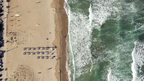Top view of many waves crashing over the coastline. Stock Footage 164881650