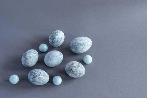 Top view of marble colored Easter eggs on a gray background. Easter backgroun Stock Photos