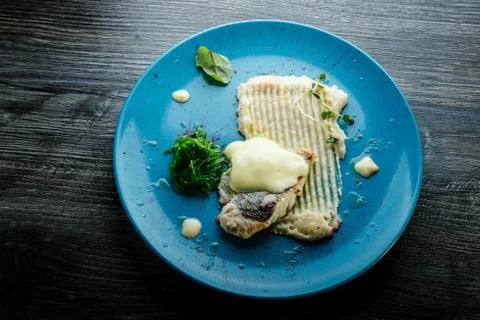 Top view on mashed potatoes, sea kale, and baked white fish fillet Foto stock