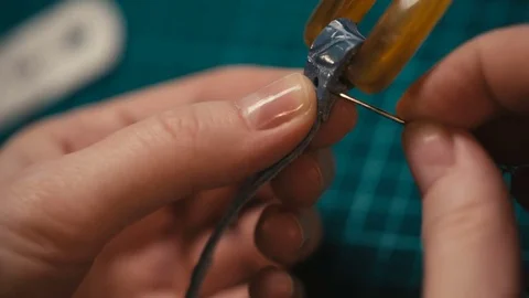 Top view of the master hands sews leather Stock-Footage 73951573