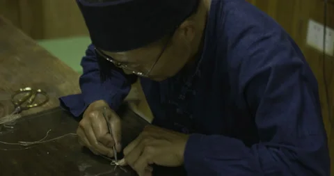 Top view Master working with small detail item Stock Footage 141356661