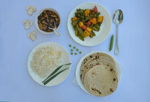 Top view of matar paneer veg, mashroom soup, roti (chapati) and rice Stock Photos
