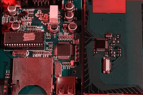 Top view of matte PCB with chip, ports, capacitors and connections 스톡 사진