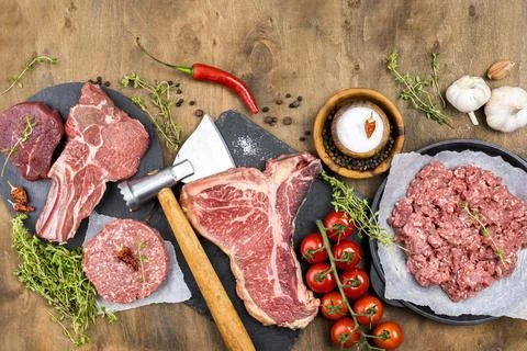 Top view meat with herbs tomatoes. High quality and resolution beautiful ph.. Stock Photos