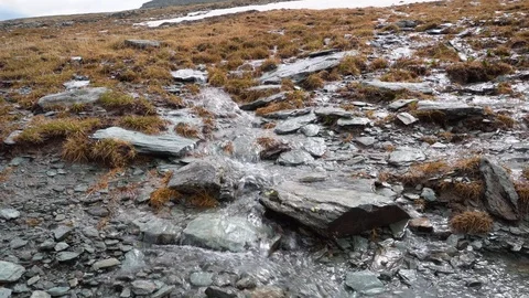 Top view of the melt ice creek in the mountainous Alps. Stock Footage 120175508