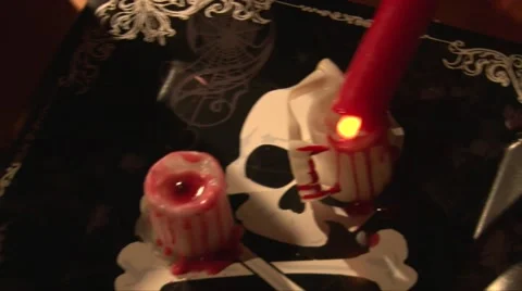 Top view  melting red wax on white candle, vampire dinner table Stock Footage 68019396