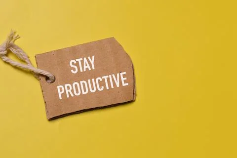 Top view of memo note written with text STAY PRODUCTIVE over yellow background Stock Photos