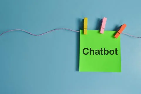 Top view of memo note written with CHATBOT. Chatbot is a software application Foto stock