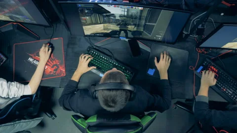 Top view of men in a computer club playing a videogame Stock Footage 113610472