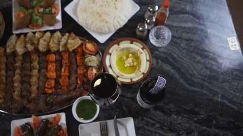 Top view of middle eastern dishes served on a table Stock Footage 129928070