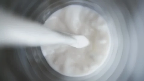 Top view milk being poured in glass, close up pouring milk slow motion Stock Footage 107707068