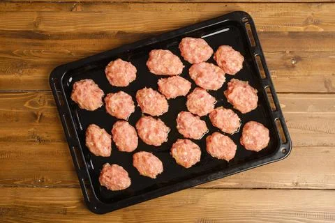 Top view of minced meatballs on a baking tray Stock Photos