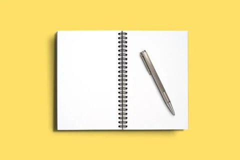 Top view Minimal design of open Notebook with pen on yellow background. Stock Photos
