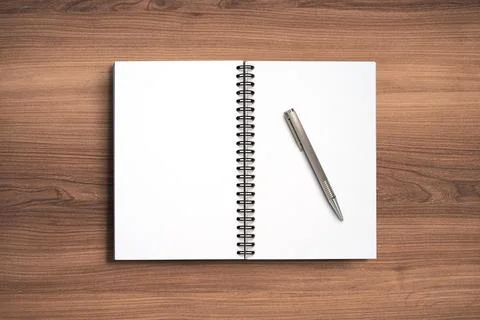 Top view Minimal design of open Notebook with pen on wooden background. Stock Photos