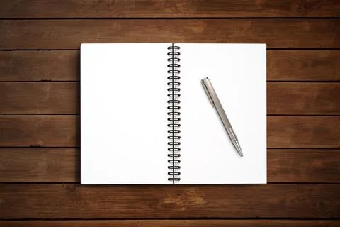 Top view Minimal design of open Notebook with pen on wooden background. Stock Photos
