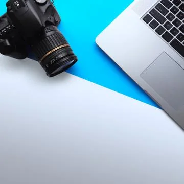 Top View of Minimal Work Space with Laptop and Camera Stock-Fotos